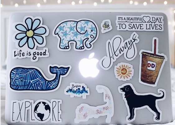 putting sticker on laptop